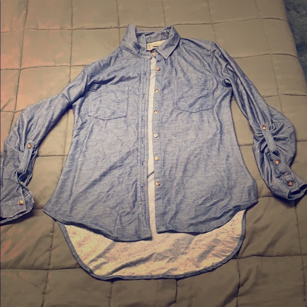Blue button up long sleeve. Fabric is soft.